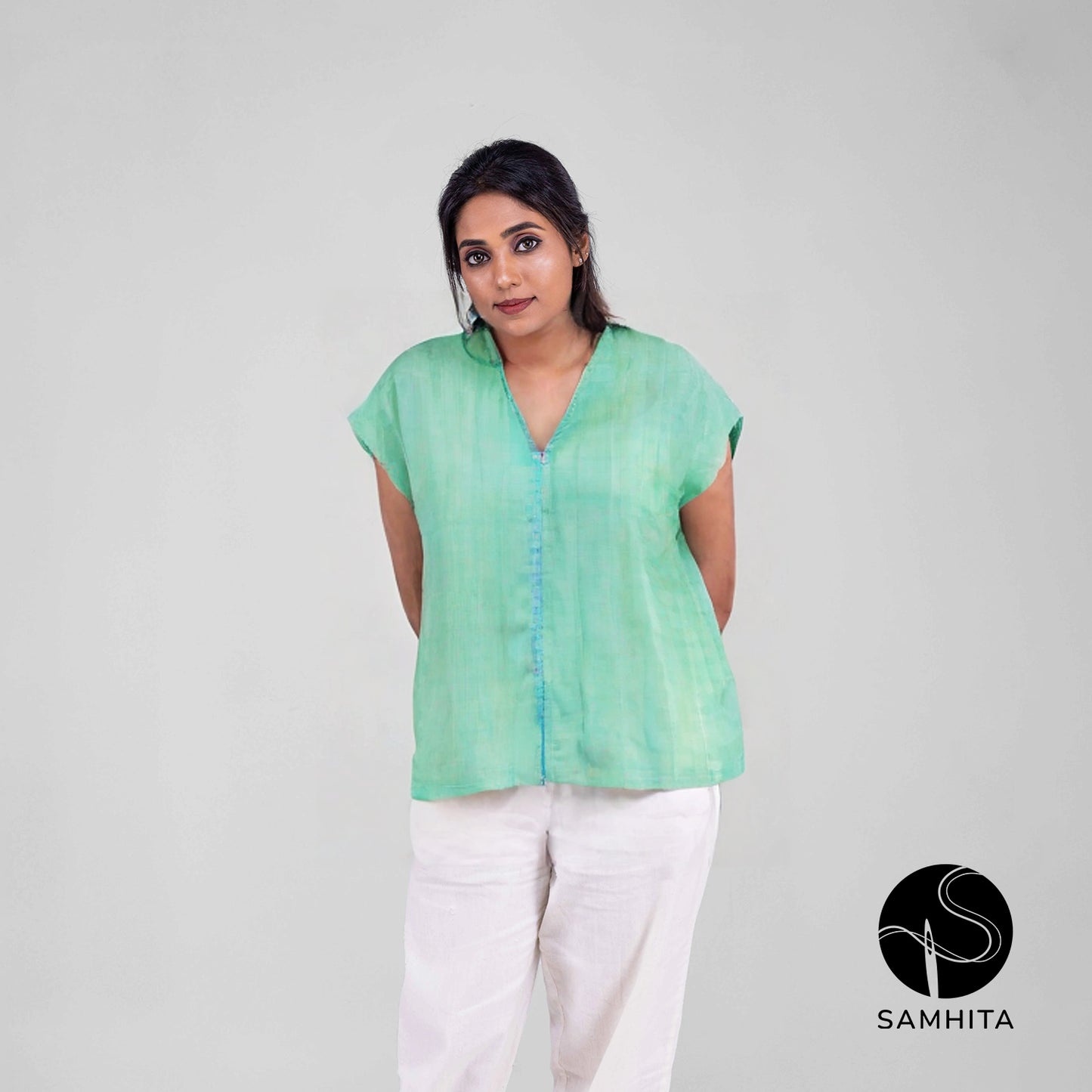 Blue-green pastel  top with cap sleeves and contrast detail in the center (WT208D)