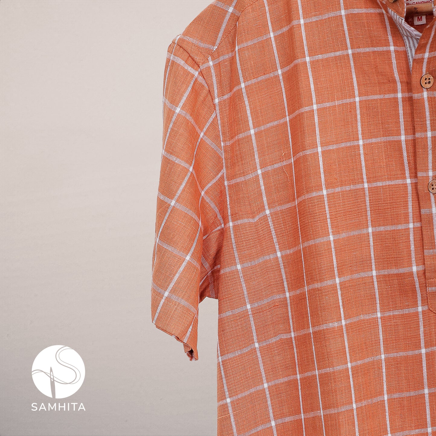 
                  
                    Men's Rust Orange Khadi Cotton Check Shirt with Half Sleeves Mandarin Collar and Wooden Button Detail (MK 101 A)
                  
                